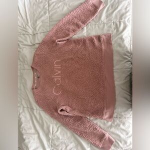 Calvin Klein sweater. It’s a shade of neutral pink. Size medium.